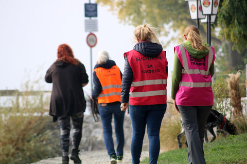 Group of women walking in a park with custom printed safety vest