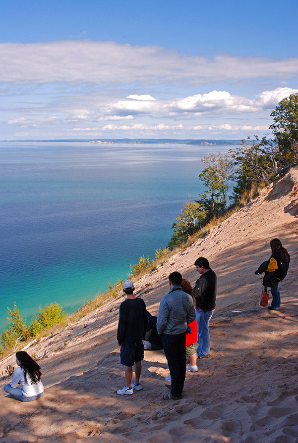 Visitors stand atop the Pyramid Point overlook and take in the view of the azure waters
