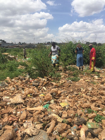Collecting waste in Kibera Nairobi Kenya