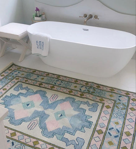 Bathroom with blue rug