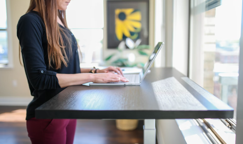 a woman standing while working