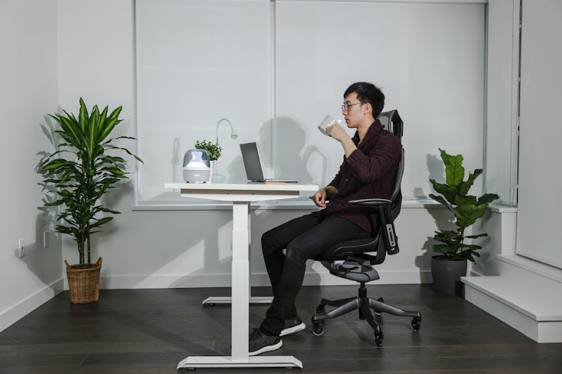 man sitting on an ergonomic chair