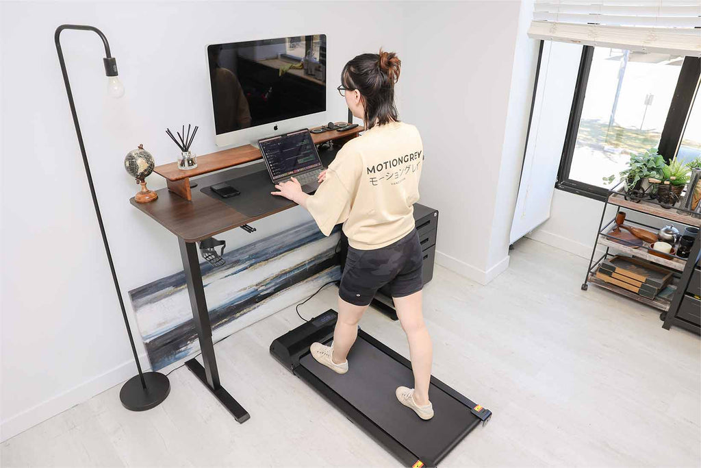 woman using an under desk treadmill