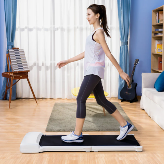 woman exercising on a walking pad