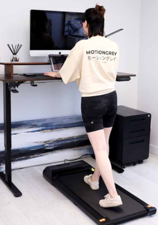woman using a walking pad while working