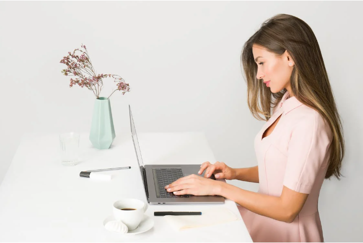 woman working on a standing desk