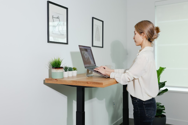 woman working with a standing desk