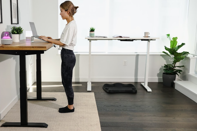 woman working on a standing desk