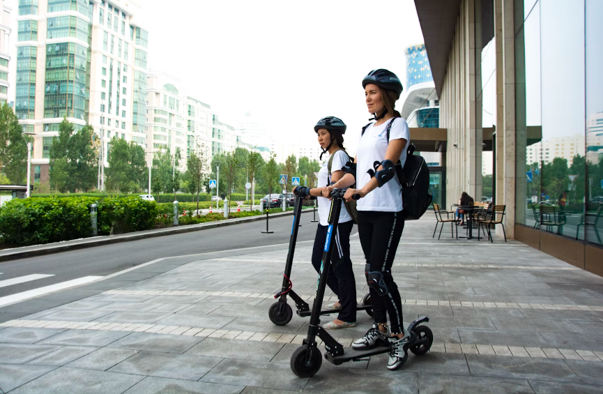women using an electric scooter