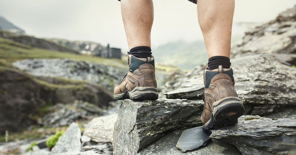 Man wearing hiking boots while hiking