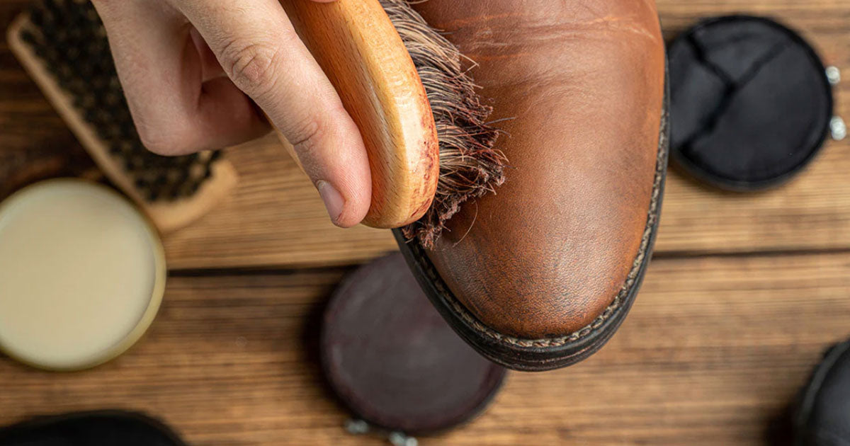 Polishing boots with brush