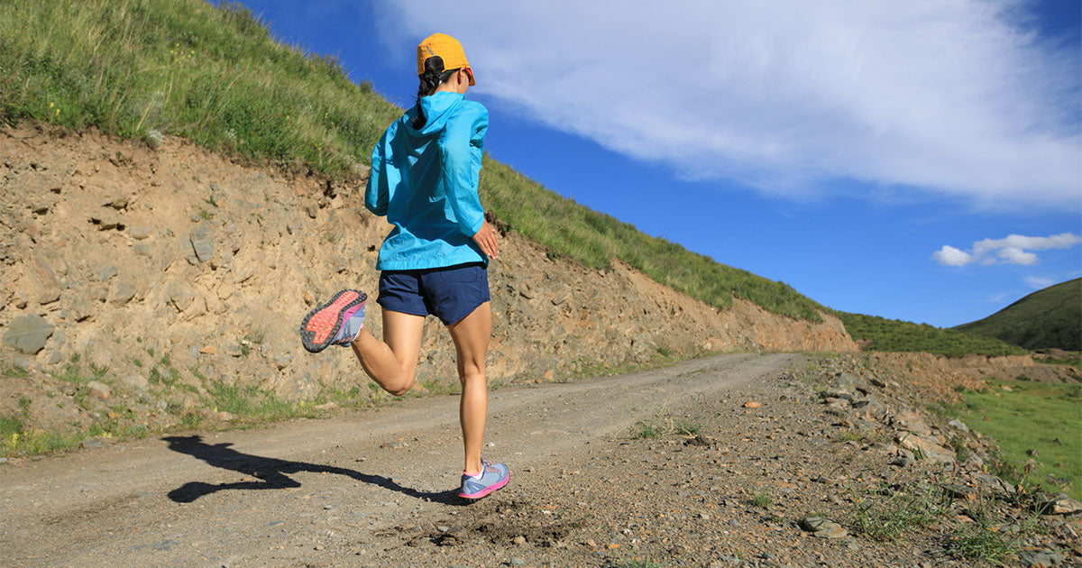 Woman running on trail