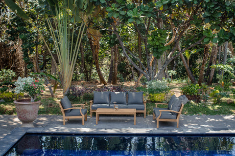 backyard teak furniture by pool