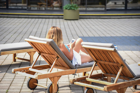 grade a teak chaise lounge poolside