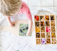 Child playing with loose parts