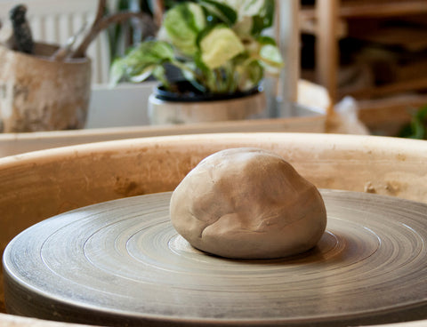 Clay ball on pottery wheel