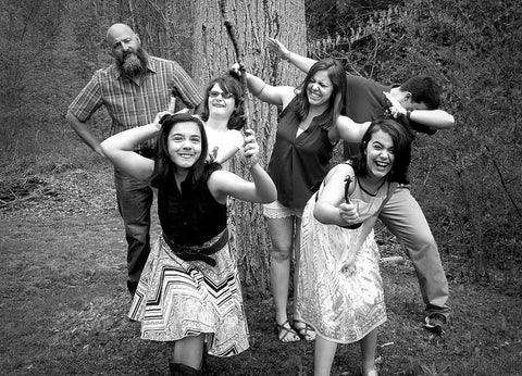 Six people acting silly in black and white.