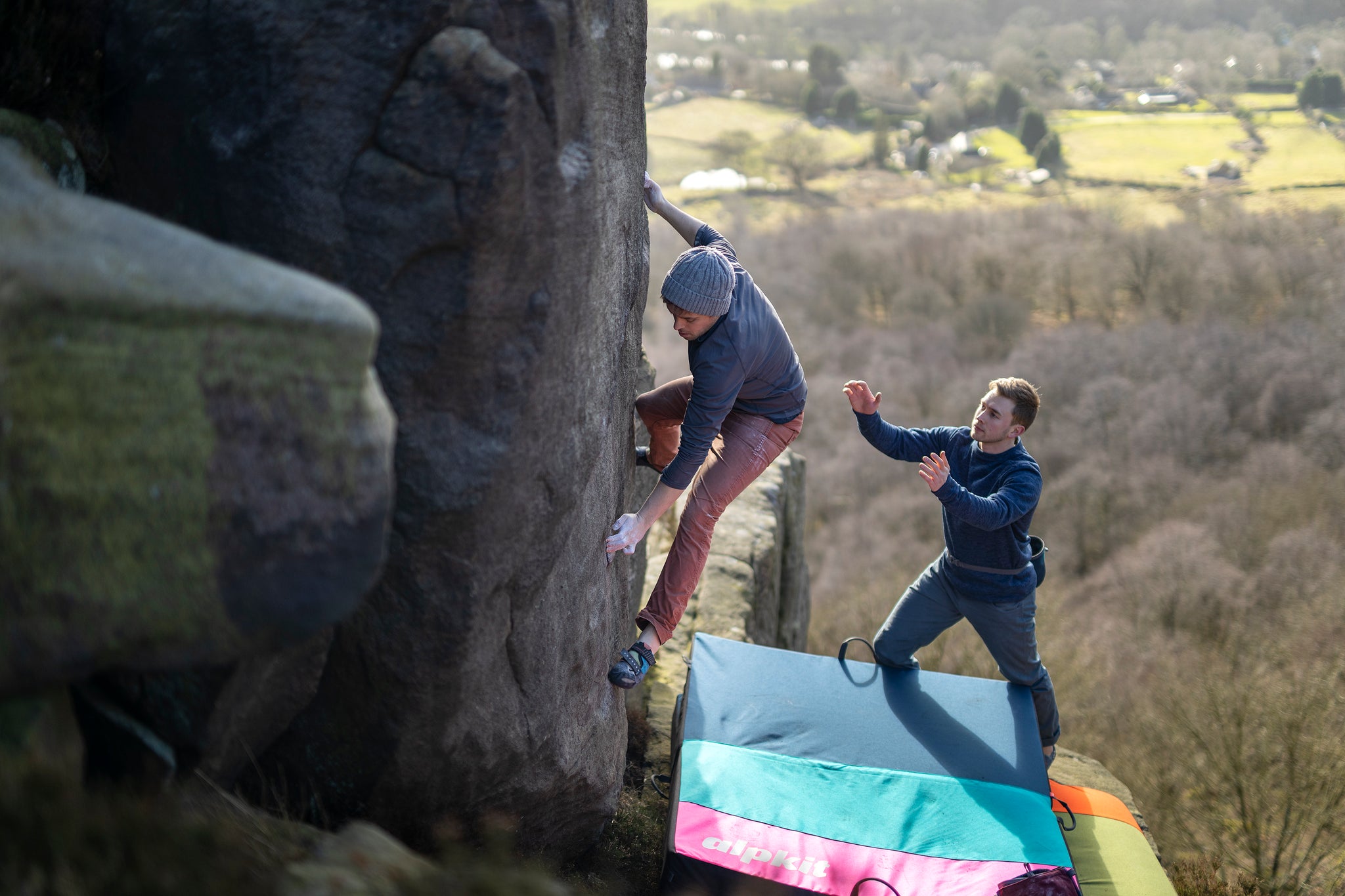 Two climbers bouldering in the Peak District National Park