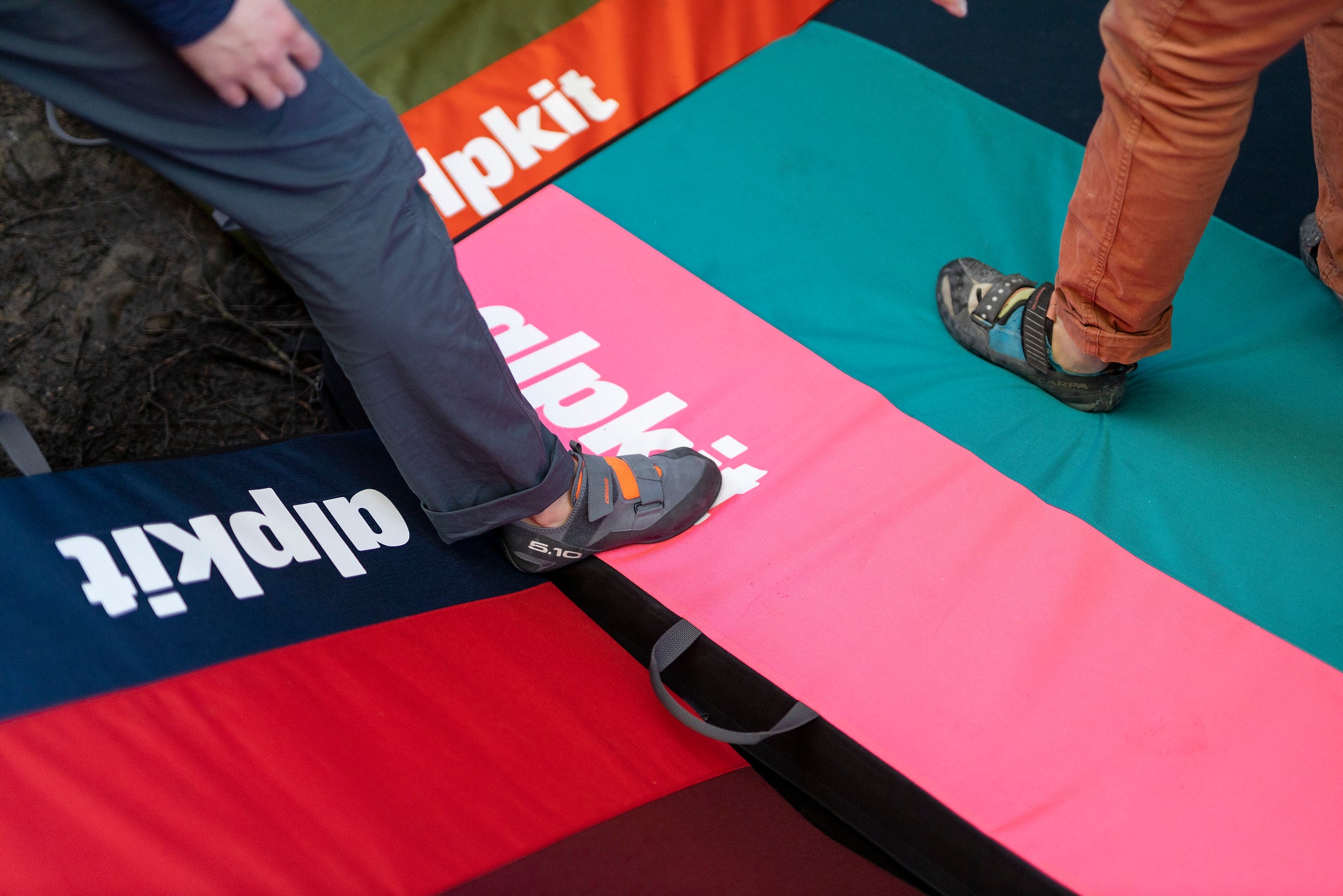 Standing on Alpkit colourful bouldering pads