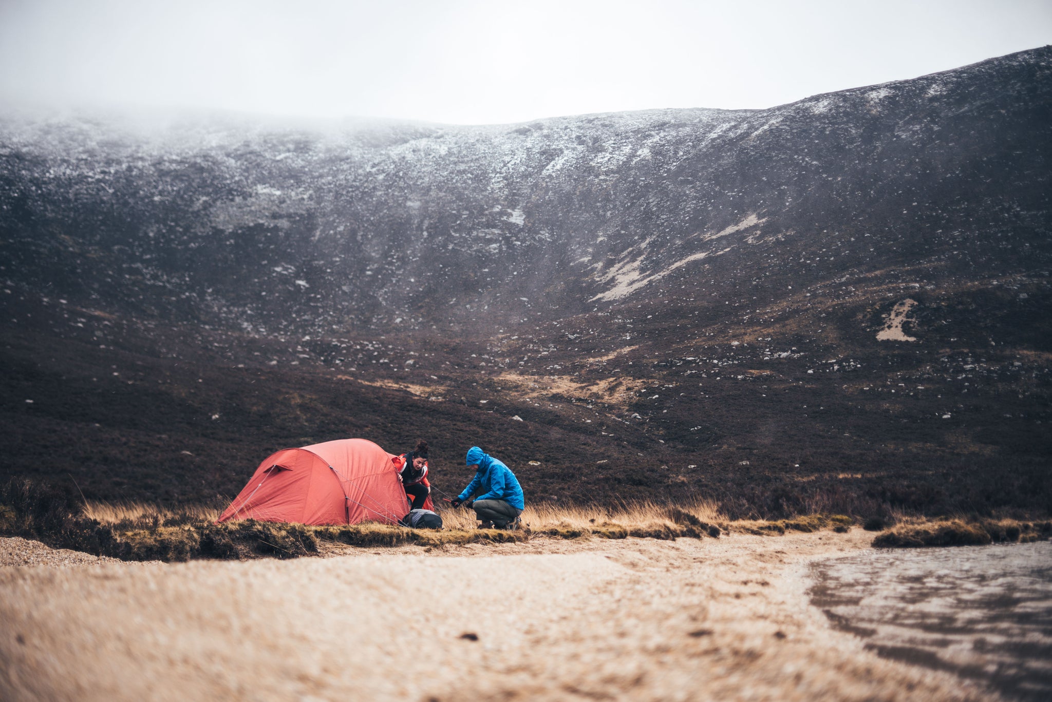 Two people wild camping on Arran in spring