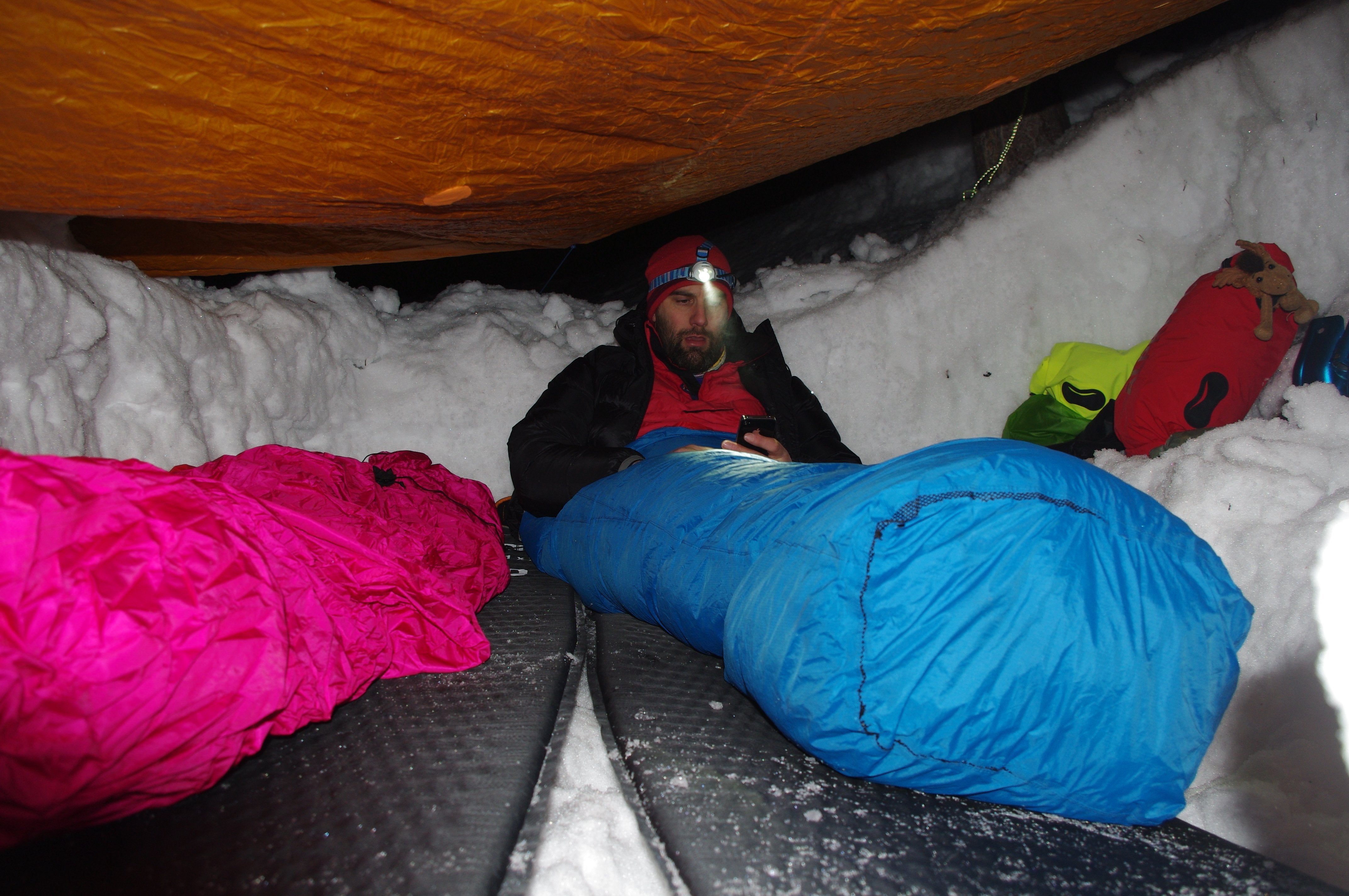 Sleeping inside a snow hole in winter