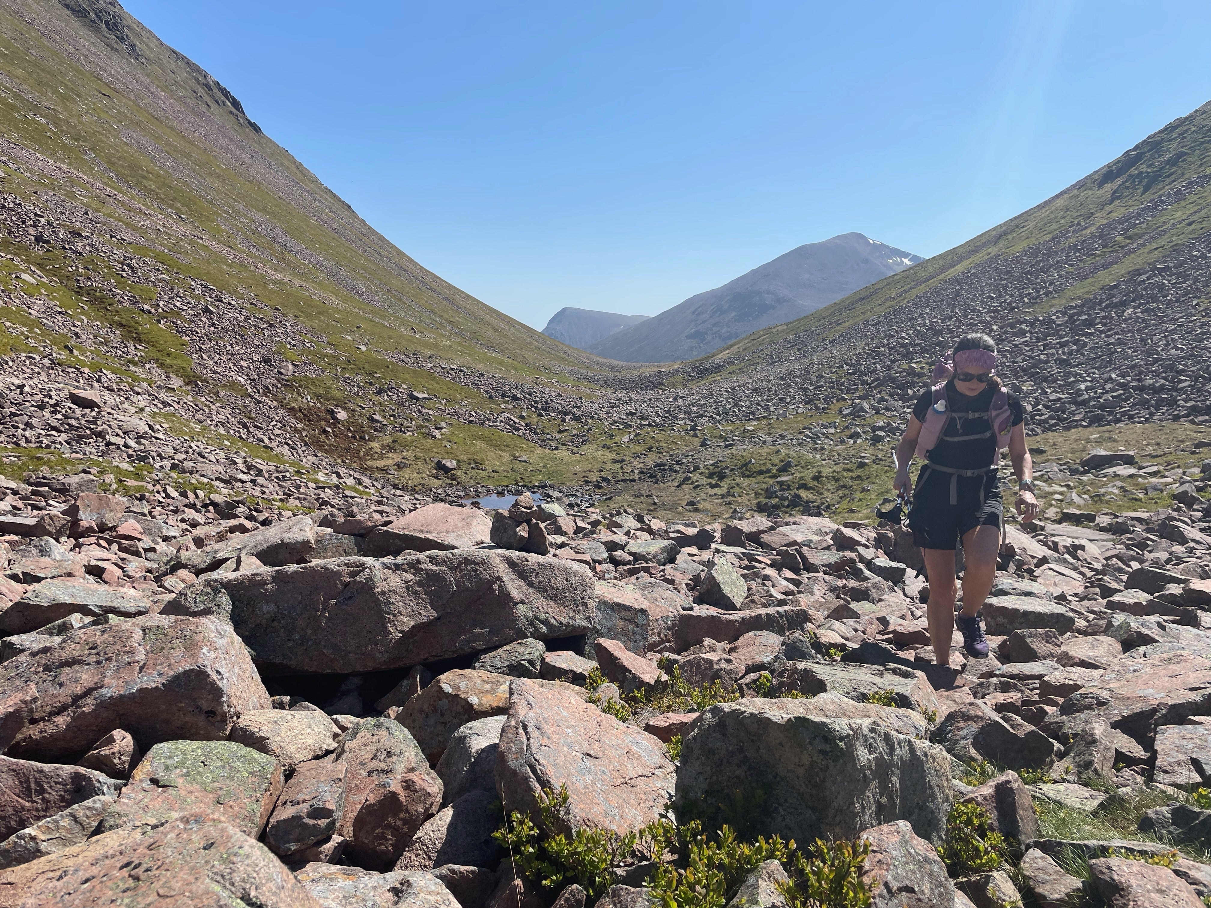 Katie palmer walking in a rocky valley