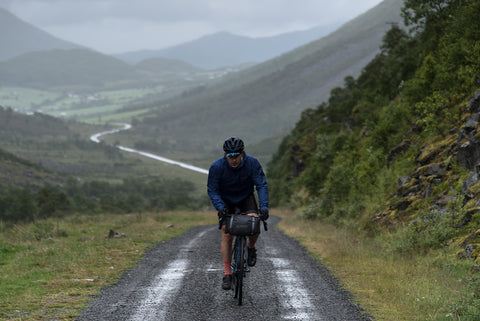 A man bikepacking off the beaten path in Norway