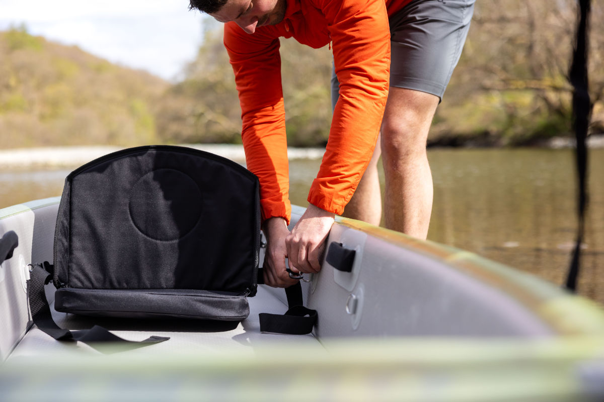 Adjusting a canoe seat in an inflatable canoe