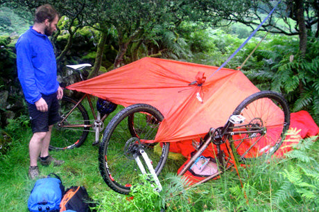 Bikepackers make improvised tarp and bivvy under Cadair Idris