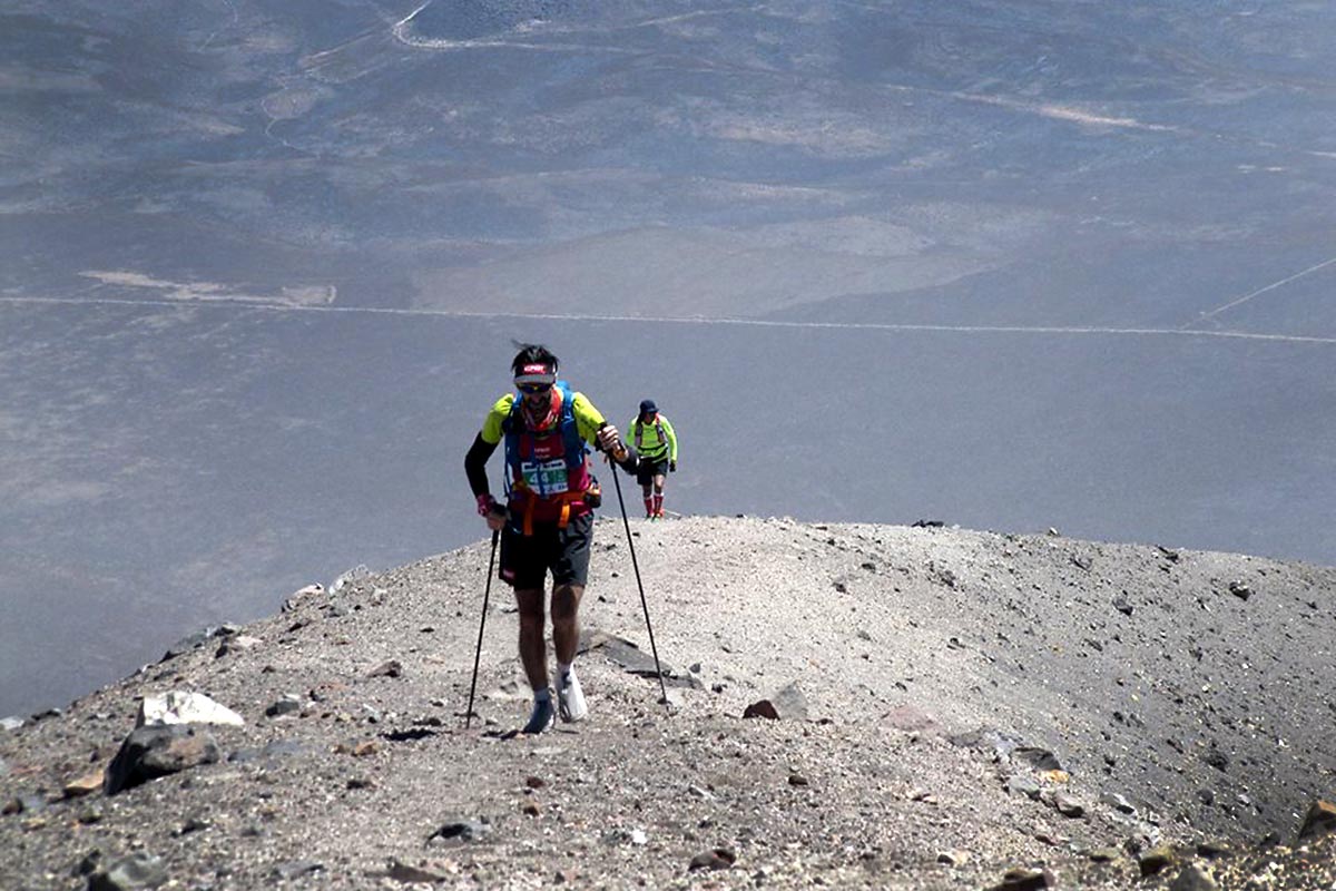 Misti skyrunners with trekking poles on ridgeline