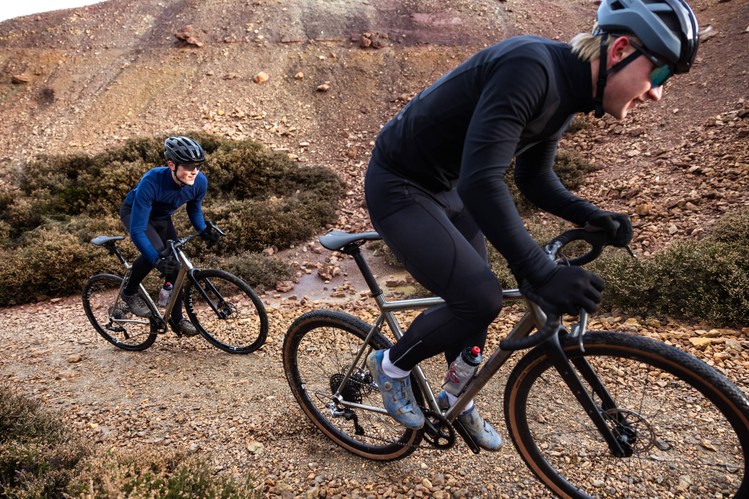 Gravel race bikes on steep gravel climb