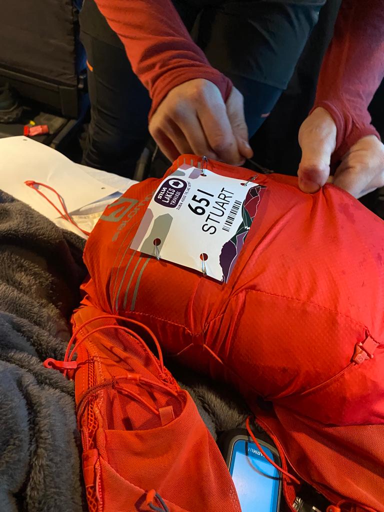 ultra marathon bag being pinned up with a race number