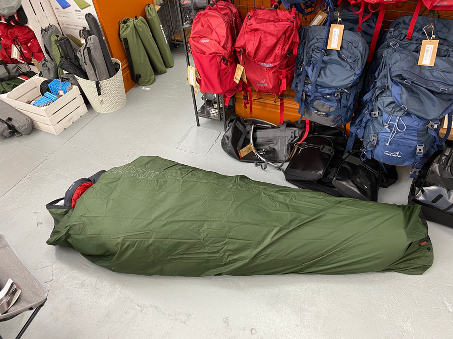 Steph trying bivvy bag in the Alpkit store