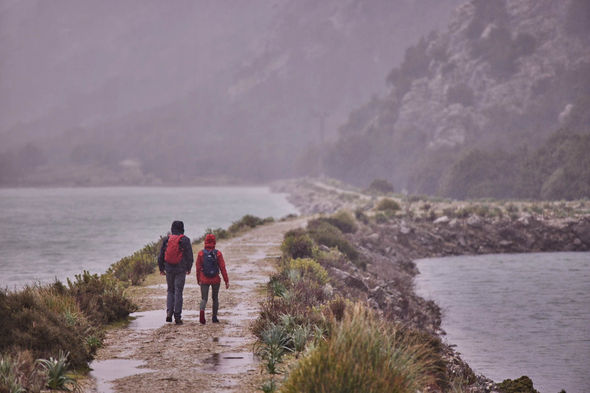 Walking in the rain around a lake