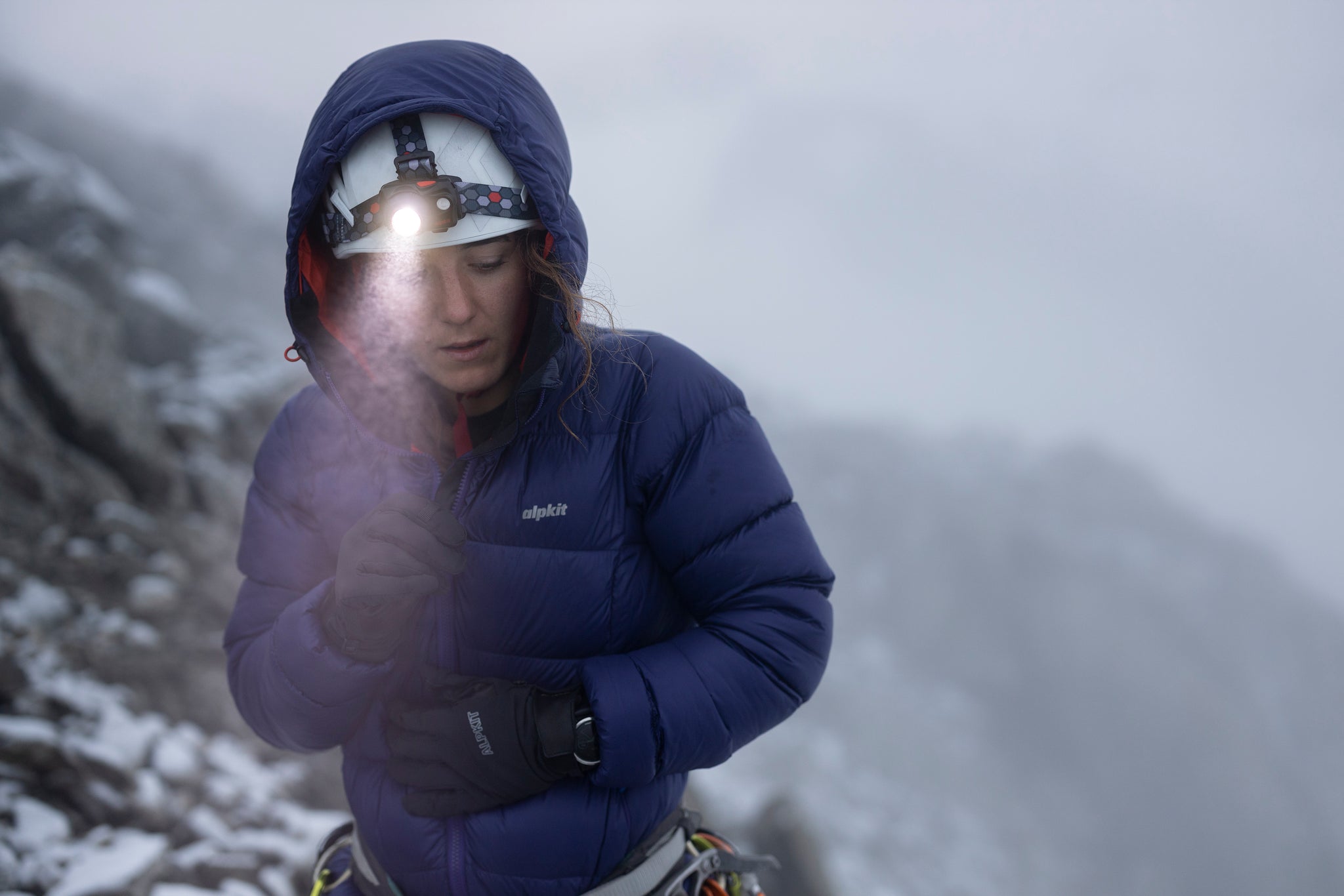 Zipping up the Fantom down jacket in the French Alps with a head torch on