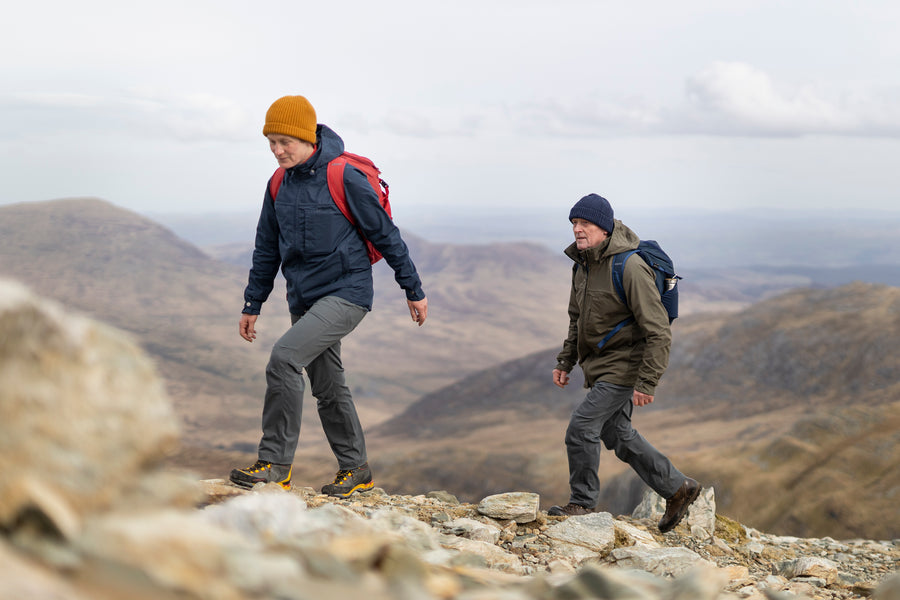 A woman and a man walking on Glyder Fawr and Glyder Fach in Snowdonia, wearing Ventile jackets