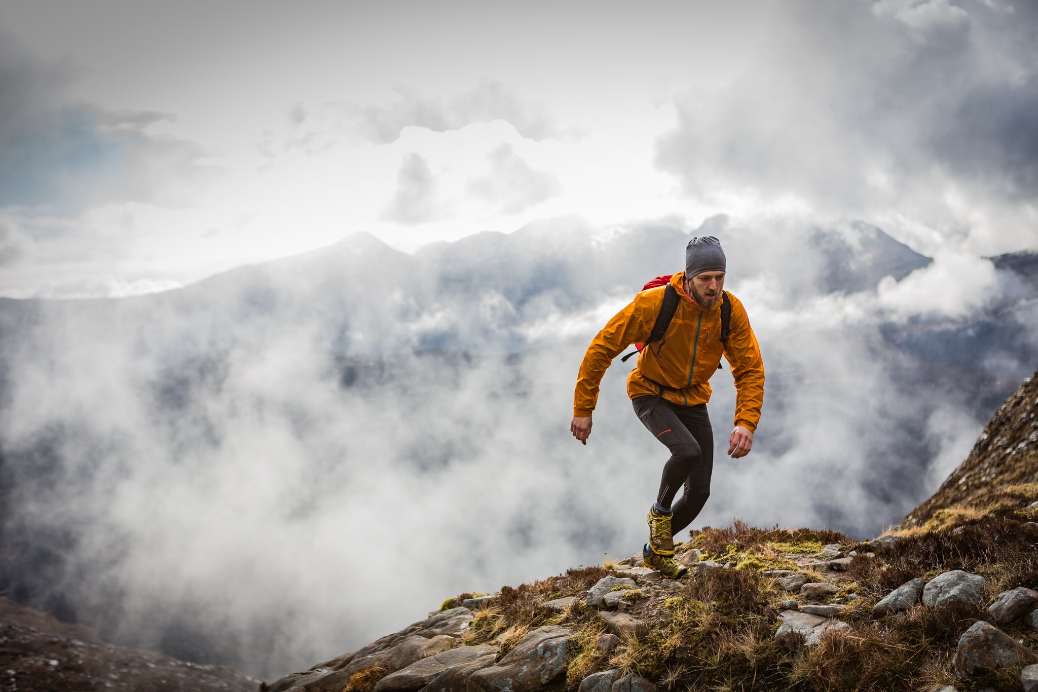 Running in the mountains in Torridon in a waterproof jacket