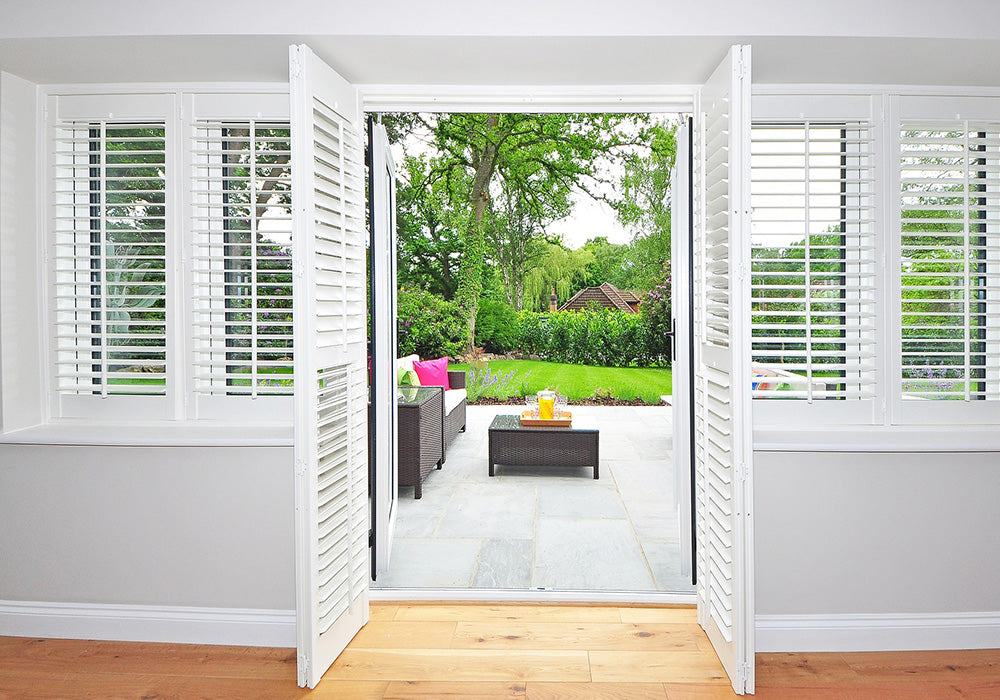 white shutters for glass doors