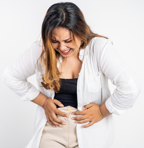 Woman clutching her stomach