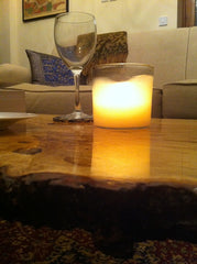 Candle on a finished live edge Oak coffee table