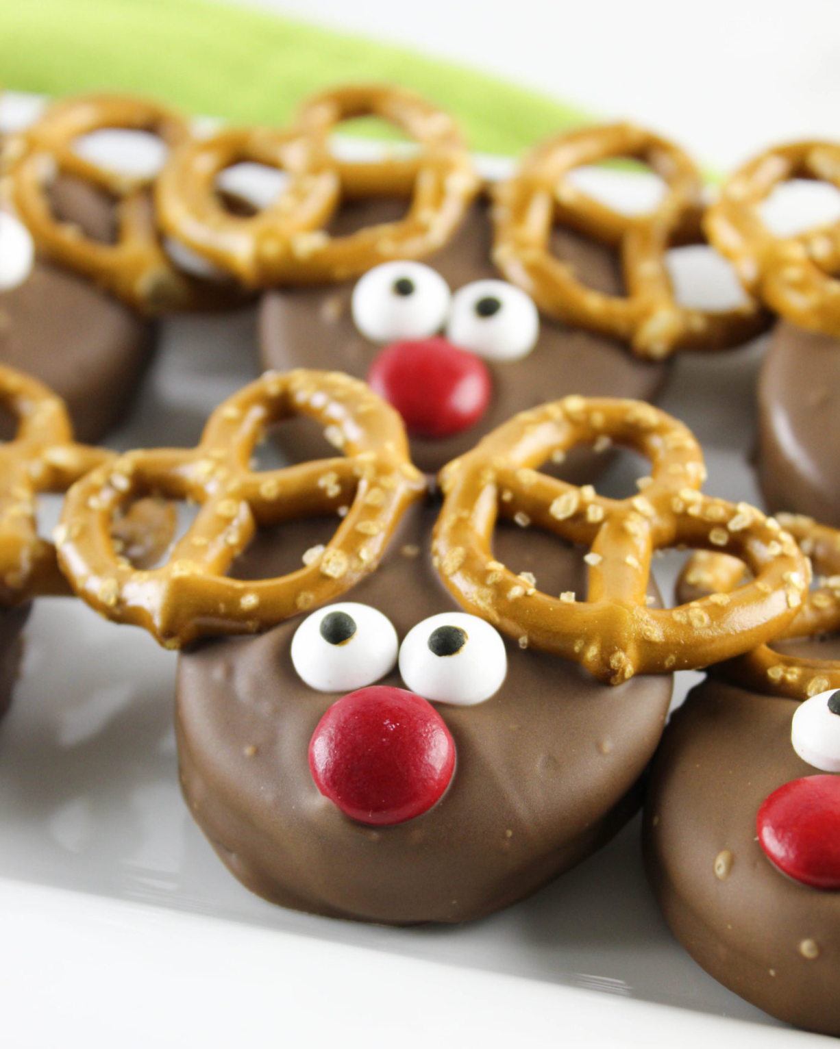 Chocolate covered Oreos made to look like reindeers (with pretzels for antlers and red m&m noses)