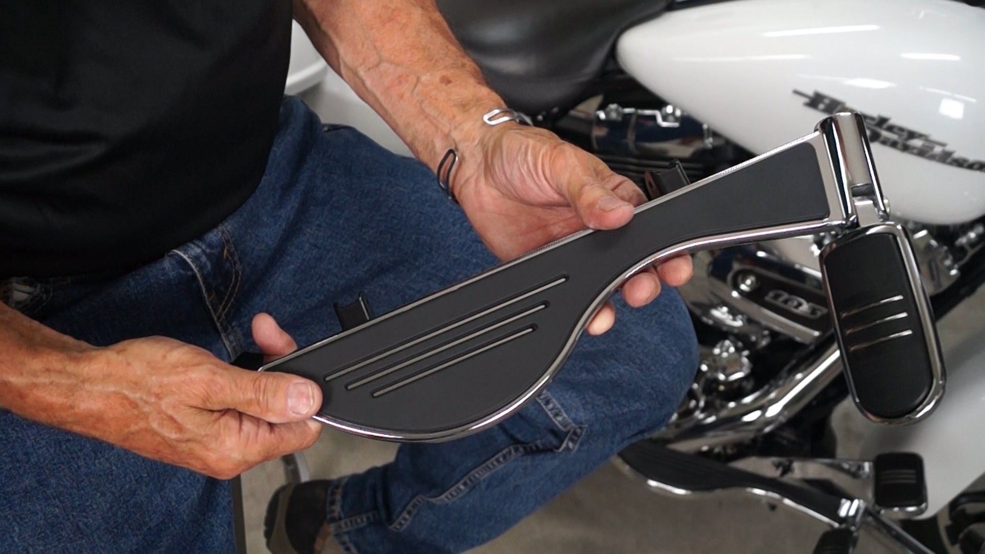 Michael Anthony holds Pegboard Motorcycle Floorboard