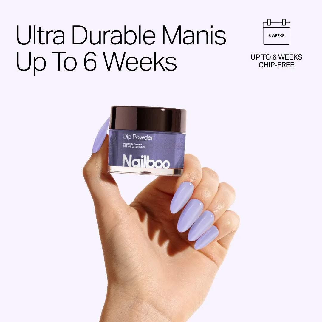 Hand holding blue Nailboo dip powder with text promoting up to 6 weeks of chip-free manicure.