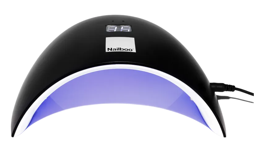 UV nail lamp with timer display and curved design.