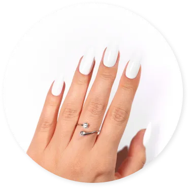 Hand with white manicured nails and a silver ring.