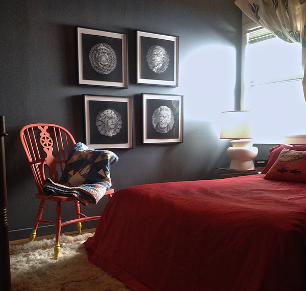 Room design by Shannon Kaye: Presidential doily prints by Ray beldner. Orange apinted Windsor chair with custom blue walls, pink silk bedspread sewn from salvaged curtains, and the Geo Fire bolster pillow made with a linen print of Shannon Kaye's painting.