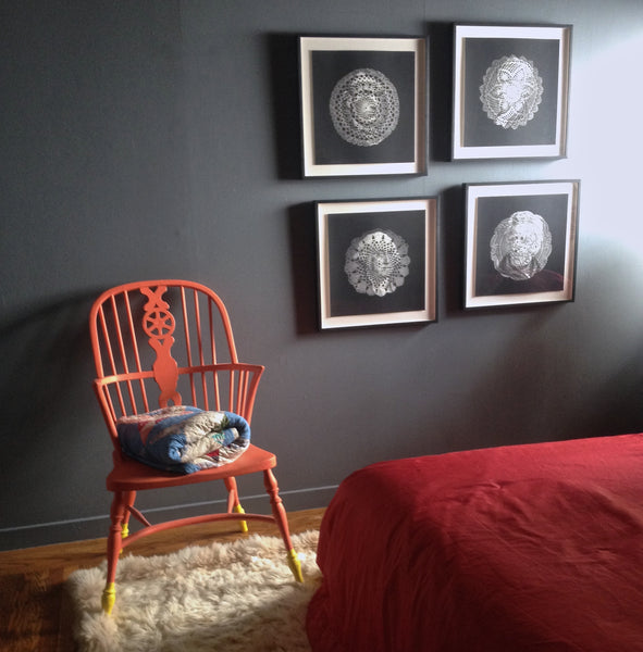 Room design by Shannon Kaye: Presidential doily prints by Ray beldner. Orange apinted Windsor chair with custom blue walls, pink silk bedspread sewn from salvaged curtains, and the Geo Fire bolster pillow made with a linen print of Shannon Kaye's painting.