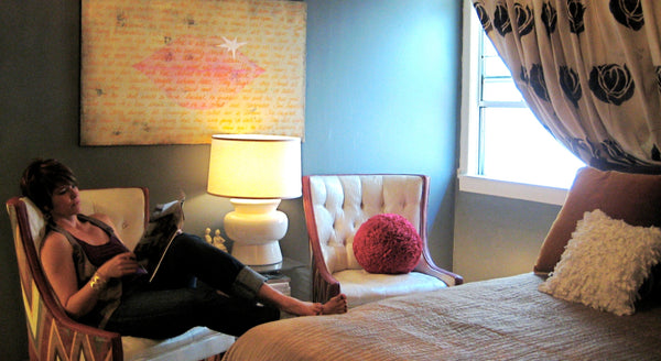 Shannon Kaye's room as seen in Apartment Therapy in 2011. Hand stenciled drop cloth curtains, painted upholstered chairs, Shannon's original 'Ode to Rocktar' painting