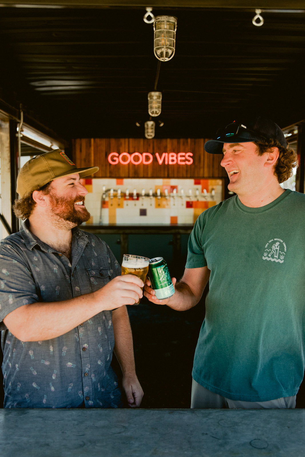 Topa Topa brewmaster and co-founder cheersing at the taproom