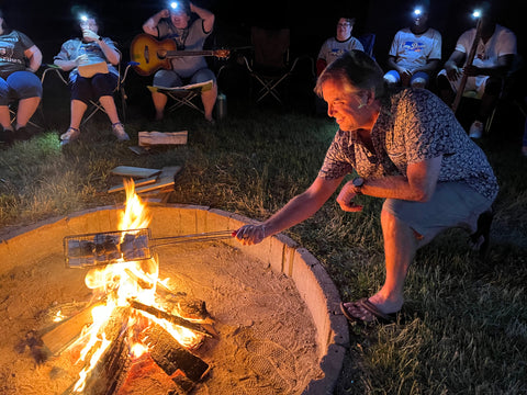 Toad&Co CEO Gordon tending the fire at Camp Dewan